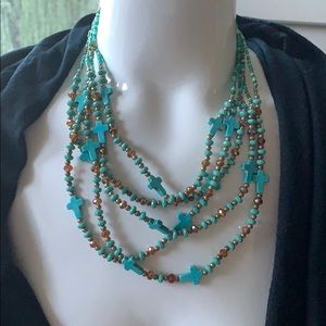 Faux cross turquoise and beaded necklace.